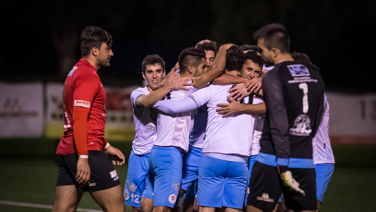 Tough afternoon: APIA Leichhardt players celebrate another goal against Rockdale City at the Ilinden Sports Centre on Sunday. Picture: Football NSW
