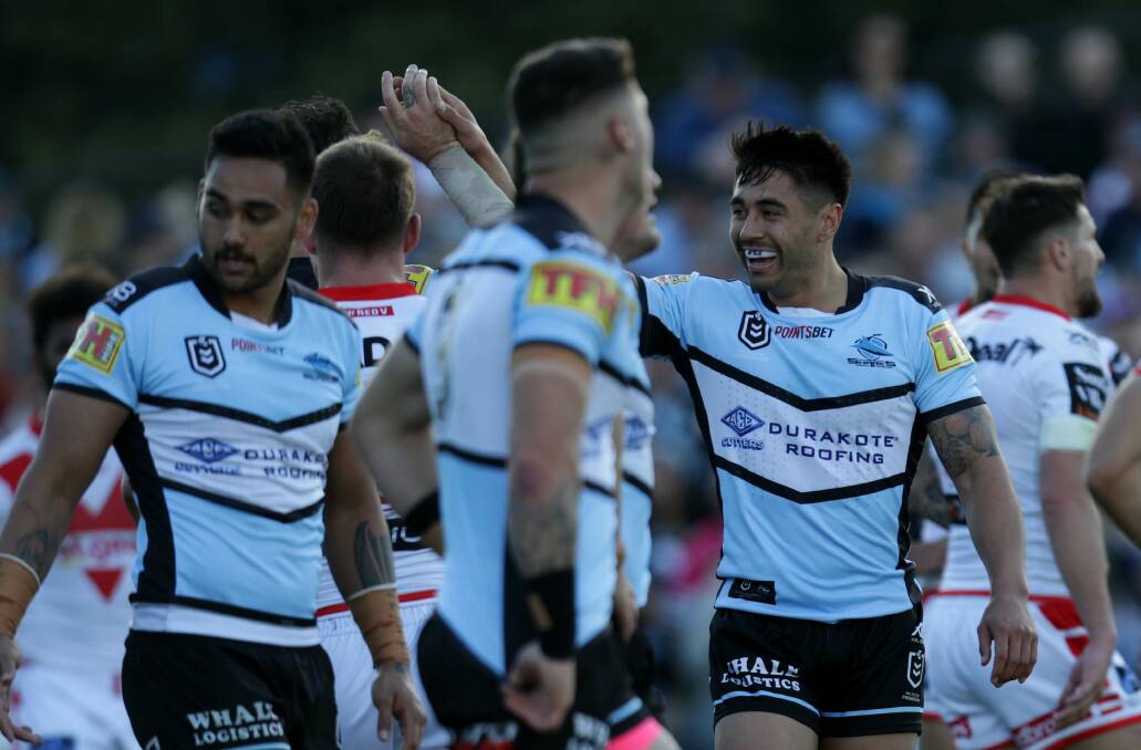 Winners: Cronulla five-eighth Shaun Johnson celebrates a Sharks try. Picture: John Veage