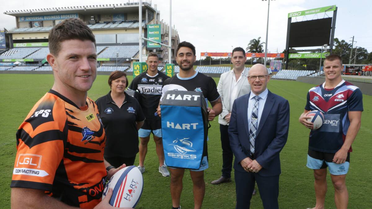 Together: Sharks stars Chad Townsend, Scott Sorensen, Shaun Johnson and Jayden Brailey with Sharks CEO Barry Russell and junior league chairman Nathan Waugh and general manager Amanda Kayes. Picture: John Veage