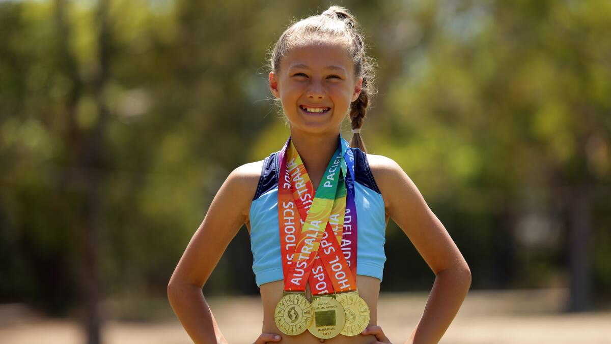 Golden girl: Ivy Boothroyd, from Grays Point, with her three Pacific School Games gold medals. Picture: Chris Lane