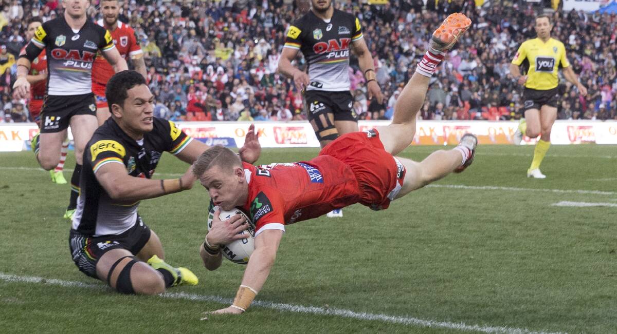 Speed and skill: Young Dragons fullback Matt Dufty dives over to score against Penrith on Sunday. Picture: Craig Golding/AAP Image