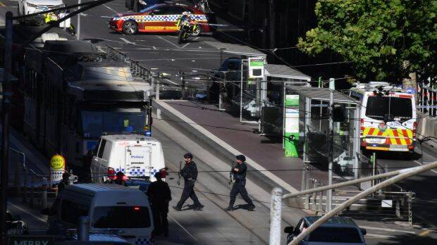 Police and ambulance at the tram stop. Photo: Joe Armao, Fairfax Media.
