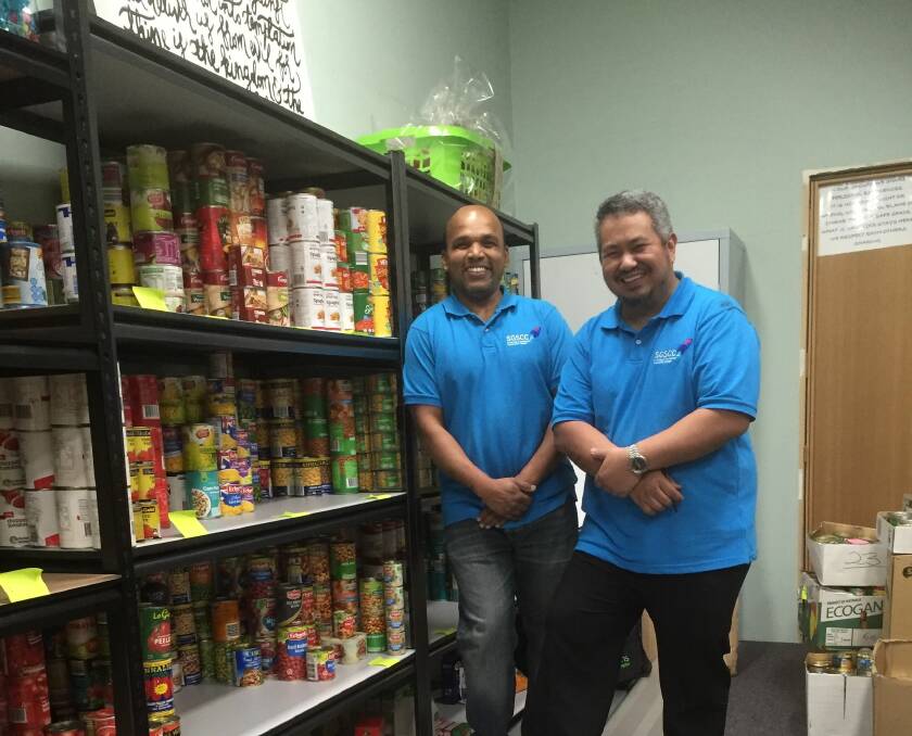 Donation: Rockdale Salvation Army volunteers stock the shelves with the large donation of cans. Picture: Supplied
