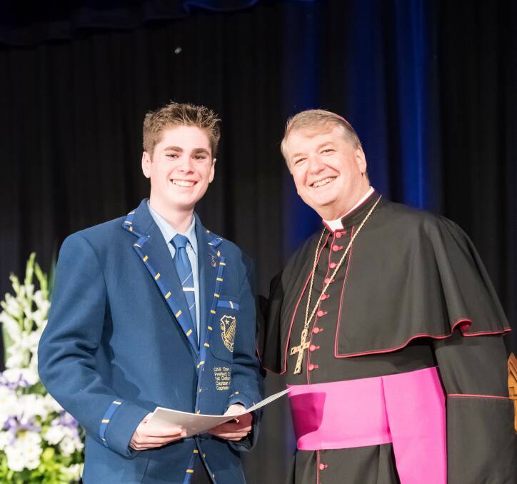 Top student: Oatley’s Angus Mullins (left) with the Archbishop of Sydney Anthony Fisher. Picture: Giovanni Portelli
