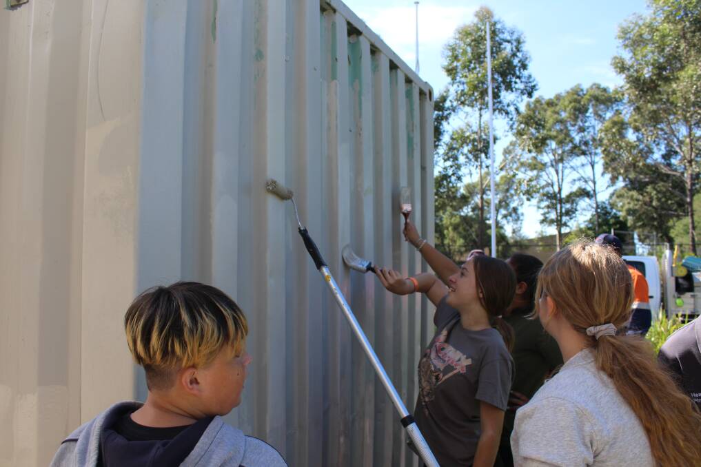 NO GRAFFITI: Georges River College Peakhurst students working on a graffitti removal project. Picture: Supplied.