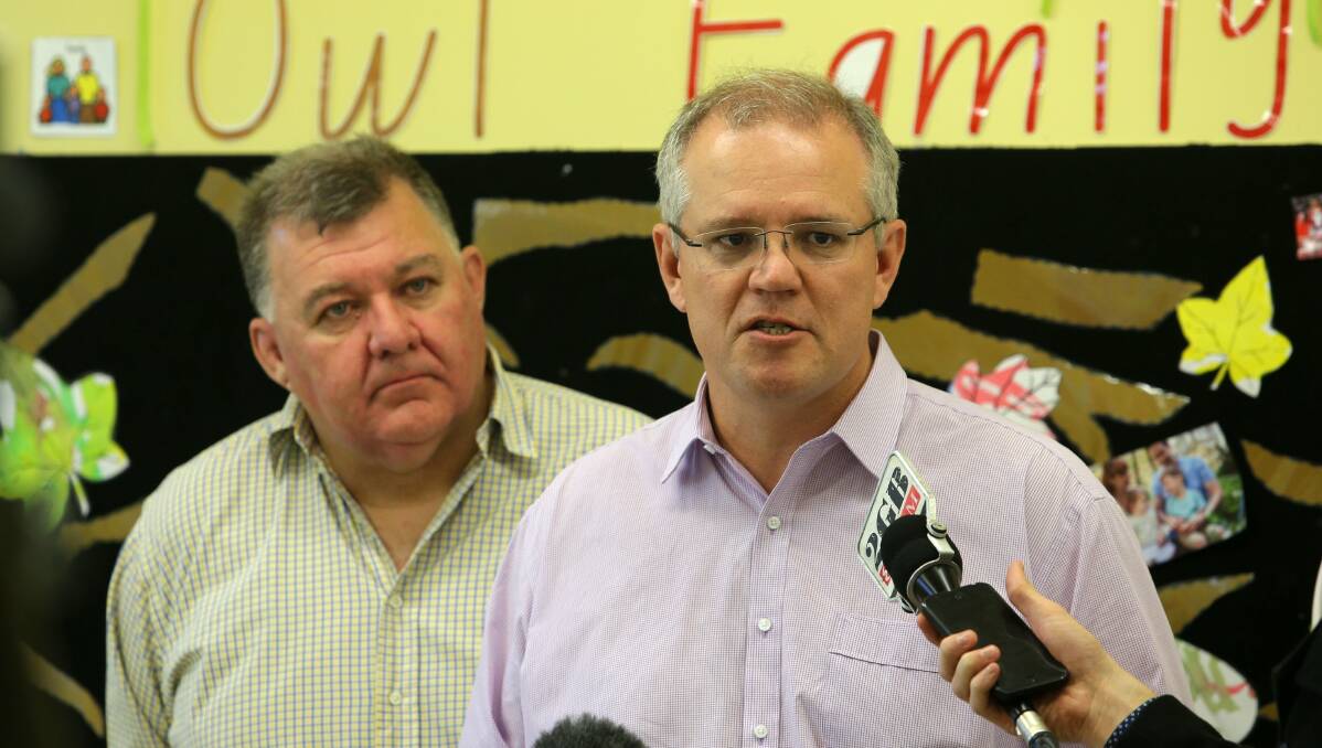 Long association: Hughes MP Craig Kelly (left) with Cook MP and PM Scott Morrison. Picture: John Veage