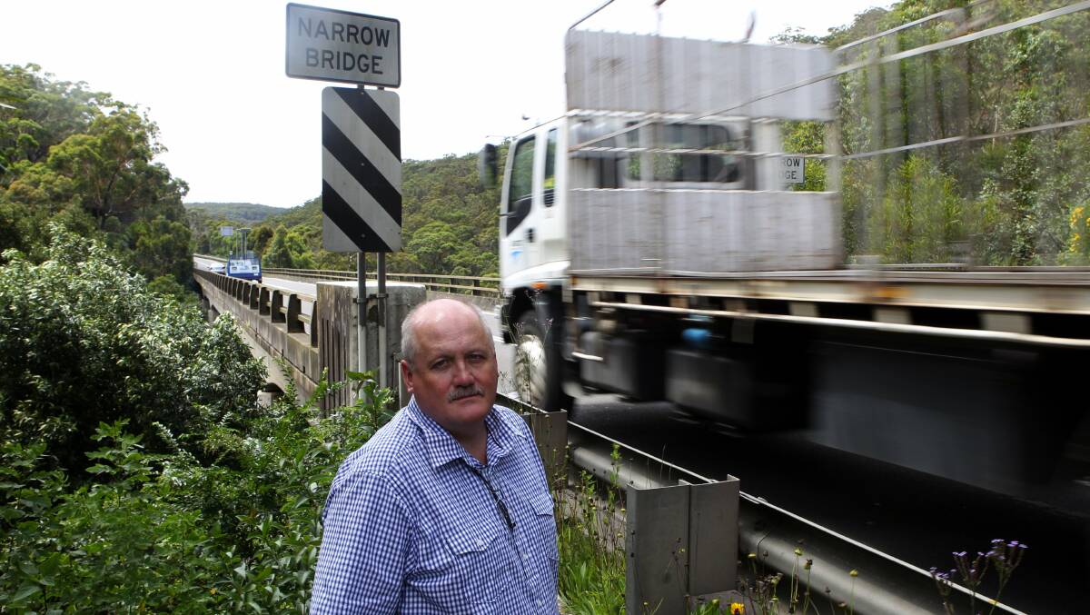 Long wait: Lee Evans in 2015 next to the narrow bridge on Heathcote Road at Engadine. Picture: Chris Lane