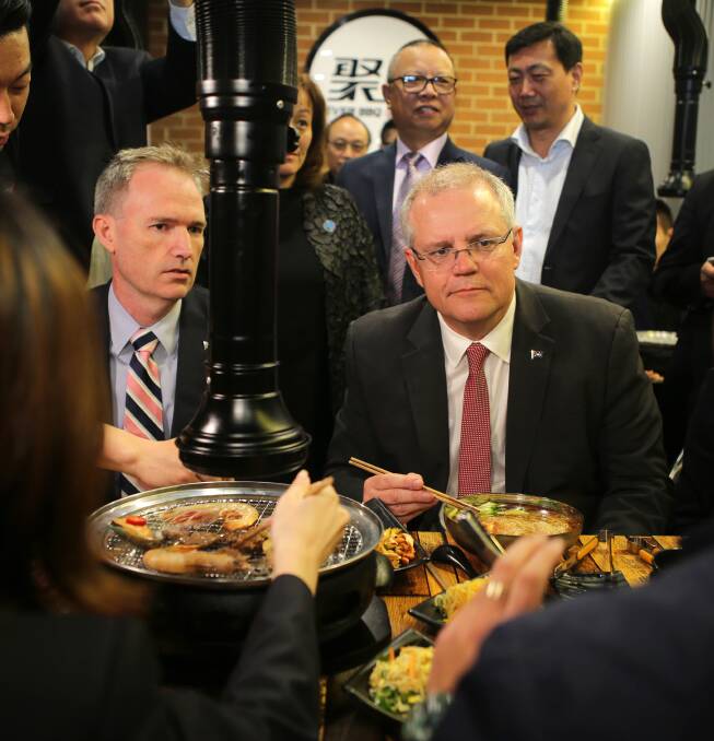 Personal leave: Prime Minister Scott Morrison (right) having lunch with MP David Coleman in the Hurstville CBD. Mr Coleman is still on leave. Picture: John Veage