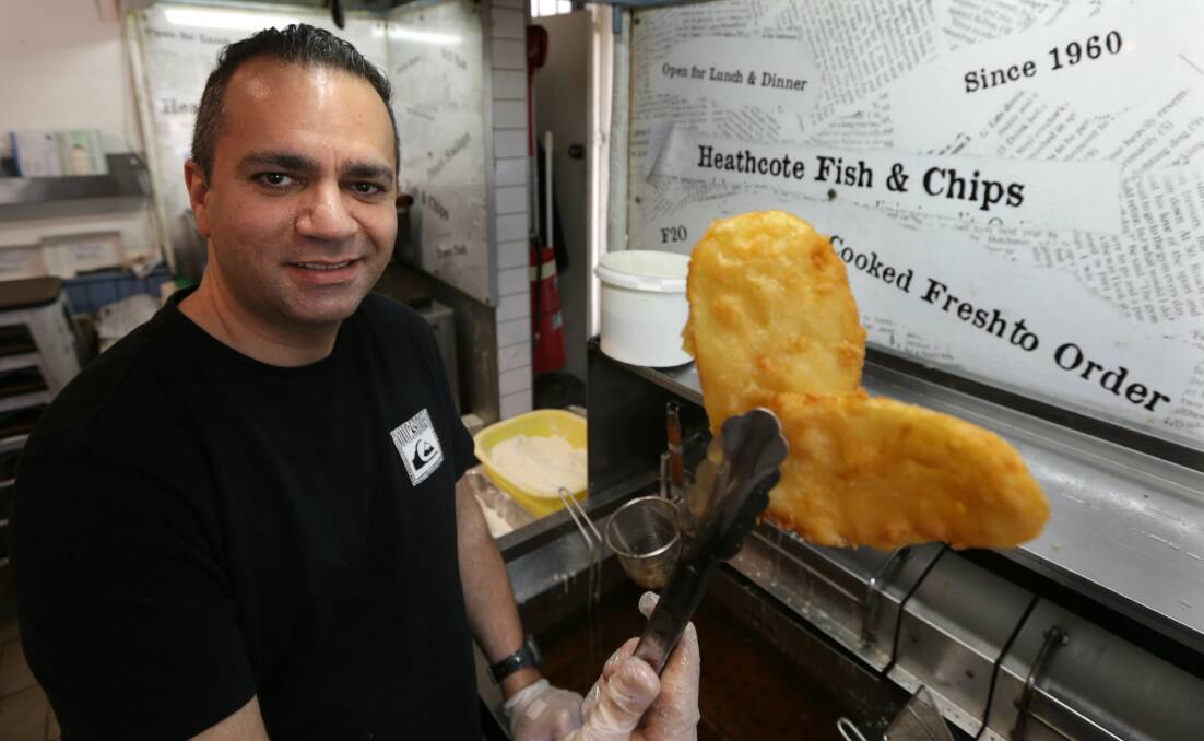 Ethan Kashi with a batch of his potato scallops, voted the best in NSW. A leader reader says his grilled fish and grilled calamari are beyond comparison. Picture: John Veage 