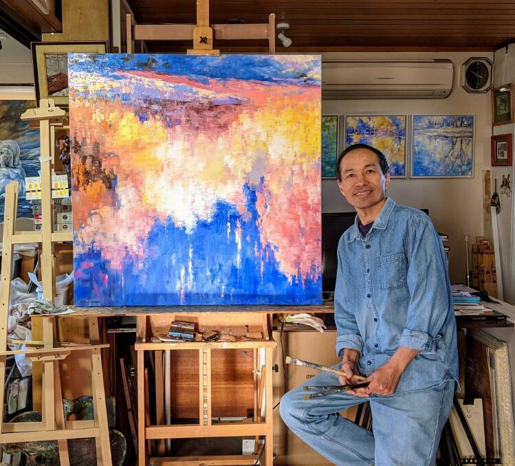 Light and shadow: Local contemporary impressionist artist Fangmin Wu in his studio. Picture: Fangmin Wu