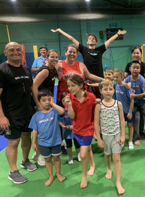 Sarah and Jason Stanton (black shirts, left) with members of the Skillz4Me community at Caringbah. Picture: Supplied