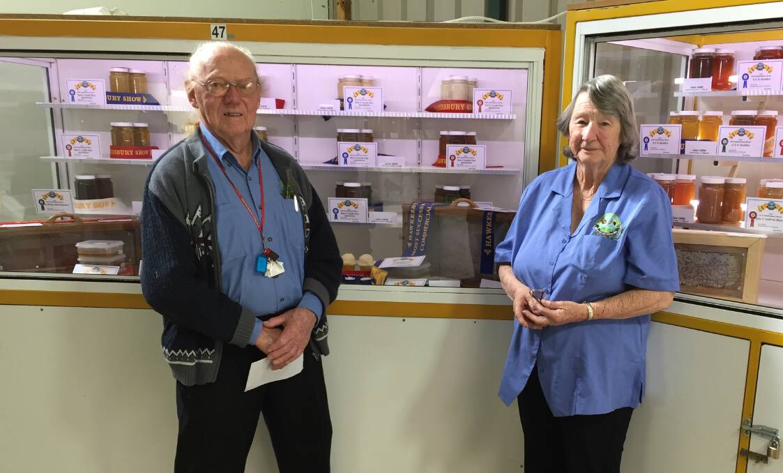 Eric and Enid have been keeping bees for 55 years and have won ribbons at the Sydney Royal. This year, they presided over the honey display at the rural Hawkesbury Show. Picture: Sarah Falson