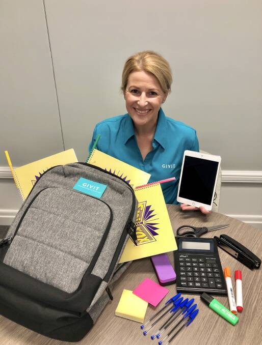 Can you help?: Sharnie from charity GIVIT with some of the back to school essentials that the warehouse is seeking for families in need. Picture: Supplied