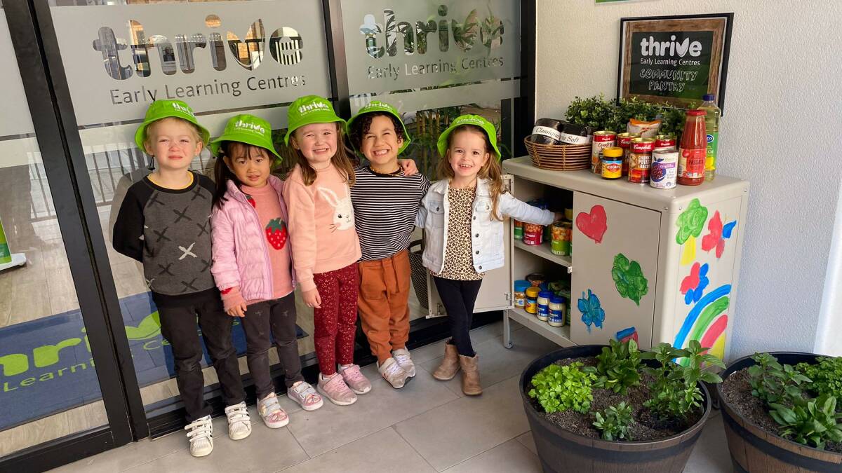 Feeding the hungry: Hunter, Mia, Kaia, Quincy and Anastasia at the Thrive Early Learning Blakehurst community pantry which is on offer for anyone in the community who is doing it tough during COVID. Pictures: Supplied