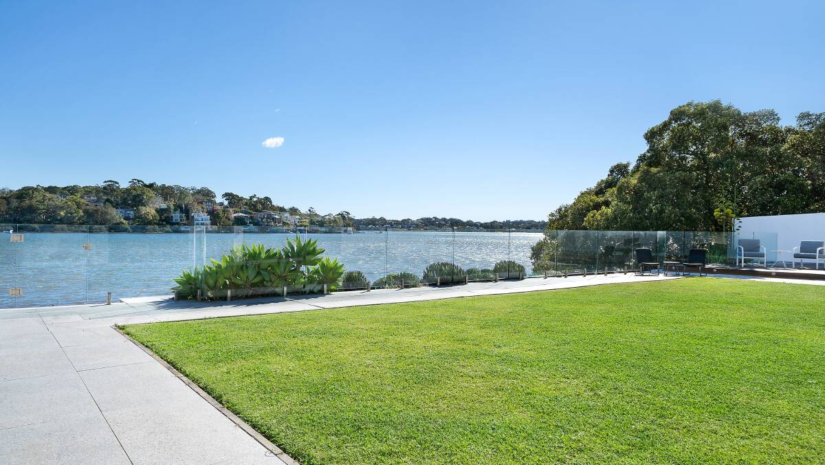 Level block: The property offers 26 metres of water frontage and views from the kitchen right onto the Georges River. Picture: McGrath St George