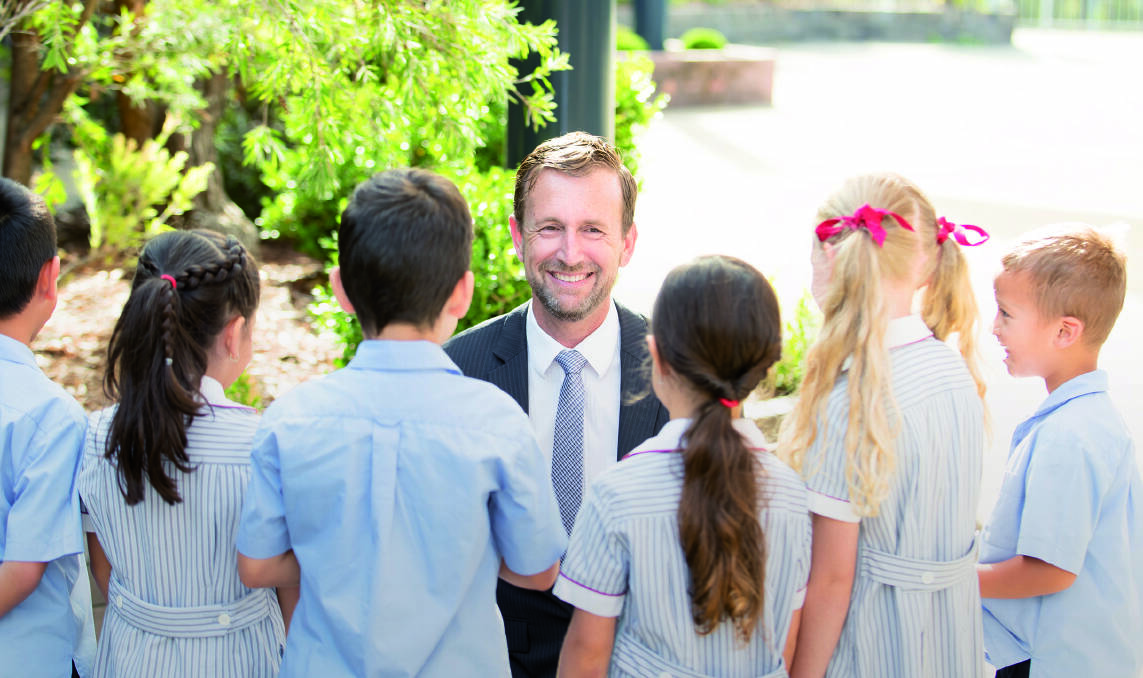caring community: Shire Christian School Principal Brett Hartley, speaking with Junior School students, said the school strives very hard to ensure that every child feels they belong. Photo: Supplied