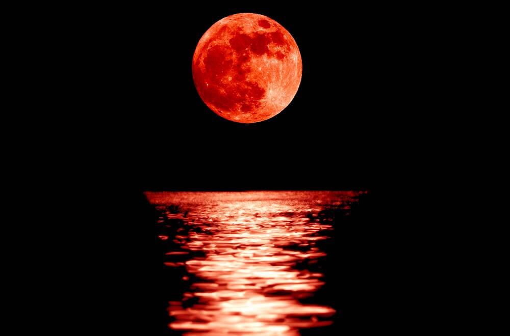 Full red moon with reflection closeup showing the details of the lunar surface. As seen from Varna,Bulgaria. Picture: Stanimir G. Stoev