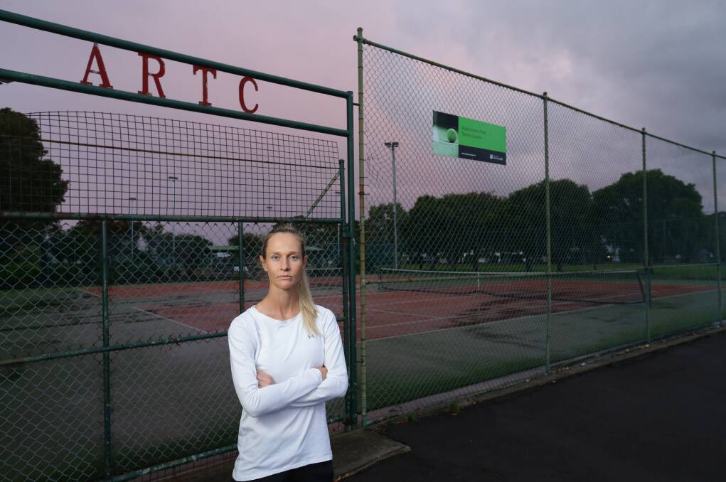 LOCKED OUT: Emma Pollock outside Adamstown Rosebud Tennis Club on Monday. Picture: Jonathan Carroll 
