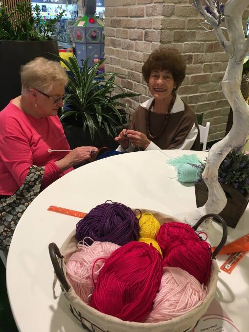 Giving back: 3 Bridges Community Services volunteers during a knitting workshop at Westfield Hurstville.