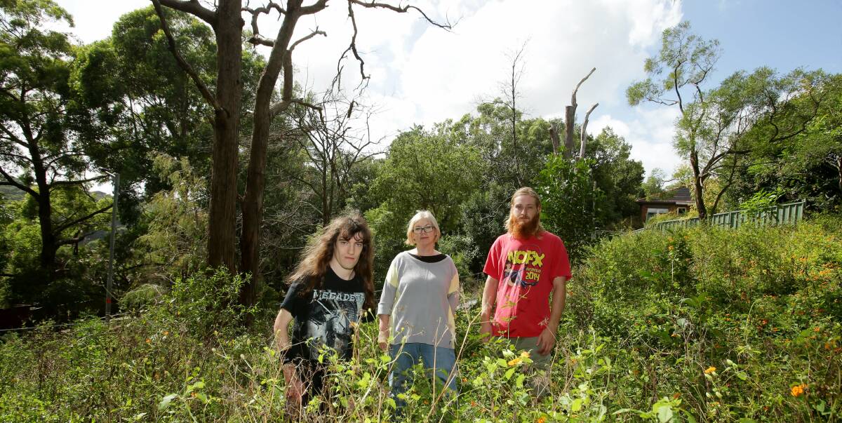 Destruction: Bardwell Park residents Cameron Hons, Kathy Hons and Stefan Goslinga are upset over a reserve which has been left to go wild. Picture: Chris Lane