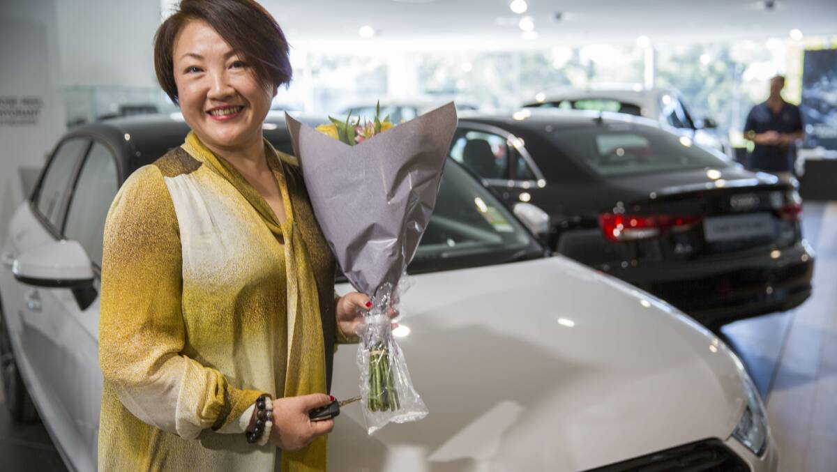 Winner: Bin Zhong with her new Audi. Picture: Supplied