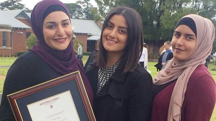 Remembering mum: Amani, Nour and Ola Haydar receive a posthumous degree of behalf of their mother Salwa. Picture: Supplied