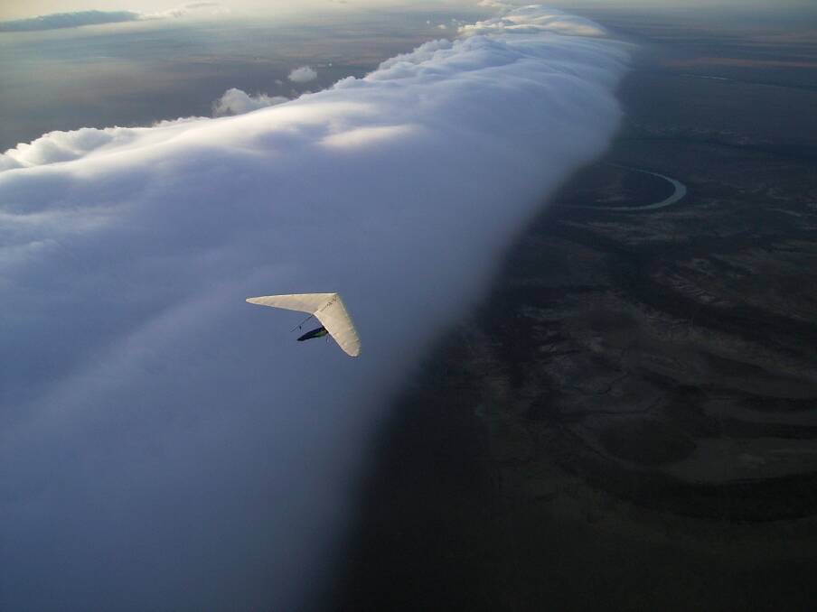 A hang glider surfs a morning glory cloud at Burketown. Photo: Burke Shire Council.