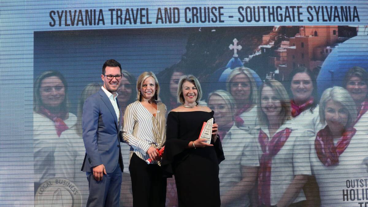Proud members of Sylvania Travel and Cruise accept their award.