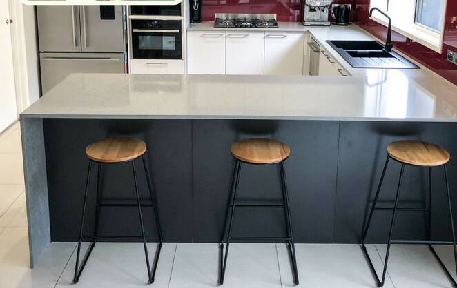 Good as new: Gina’s makeover was a mix of original cabinets, new cabinets and doors, soft close drawers, stone bench top and splashback. Photo: Dream Doors Kitchens.