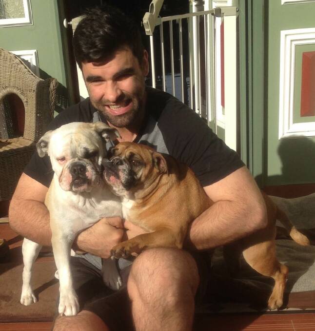 Grass is greener: Cronulla dog owner Daniel O'Connor, pictured with his two bulldogs Hank and Stevie, is bringing pet care innovation to Sutherland Shire.