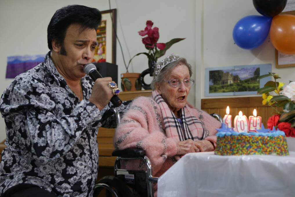 Sing-a-long: Peggy was treated to a guest performance by "Elvis" on her big day. Picture: John Veage