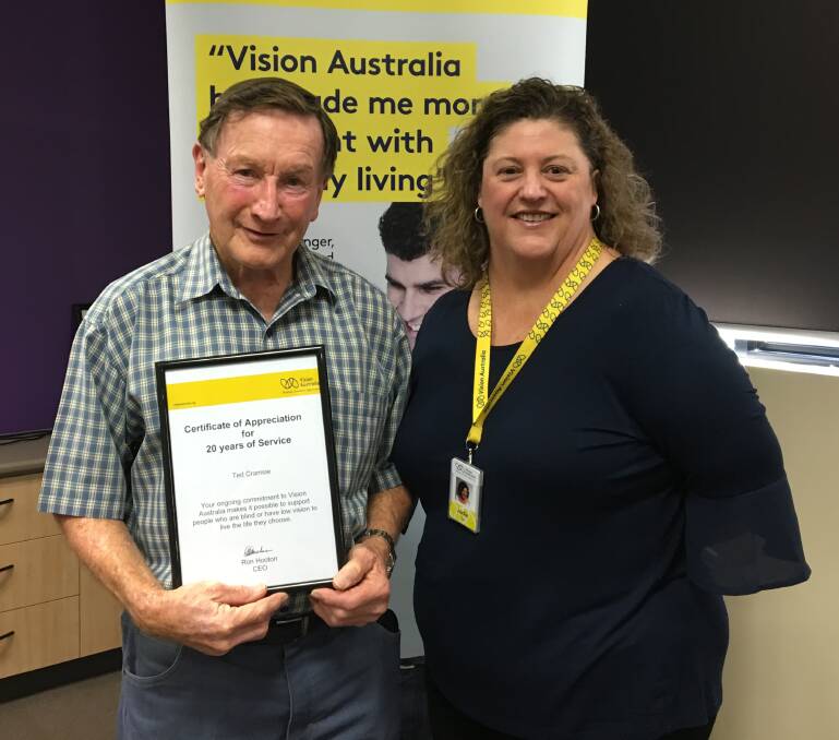 Ted Cramsie has volunteered with Vision Australia for 20 years. He received his award from Vision Australia's Jodie Cox.