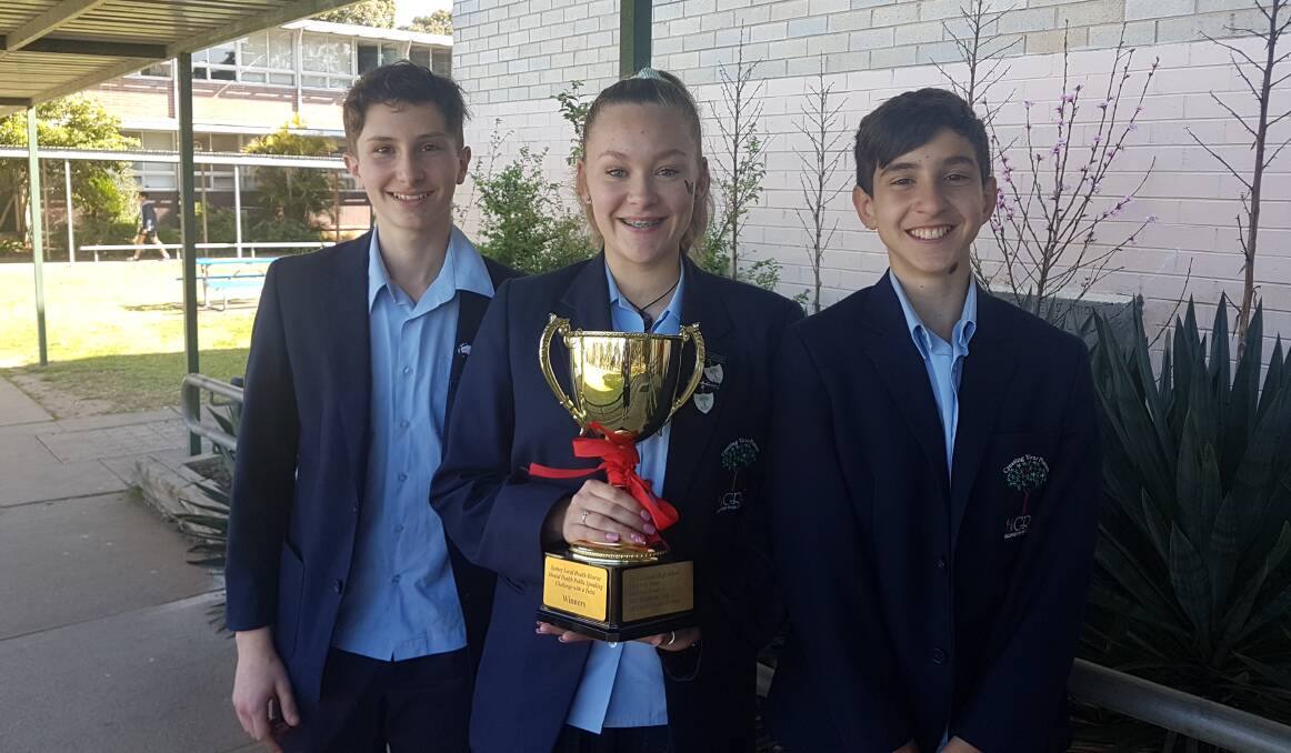Voices well raised: Georges River College Peakhurst students Tayanytah Iverach, Brendon Lambert and Andrei Esdaile-Watts take home a win for their debating skills.