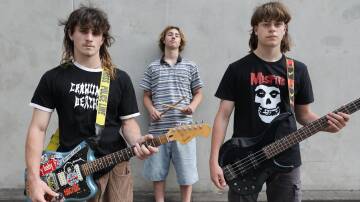 WoodHill band members Noah McCallum, 17, on vocals/guitar, Max Lizzo, 17, on bass and drummer Flynn Williams, 16. They perform their first headline act for their album launch at Caringbah Hotel on November 24. Picture by John Veage