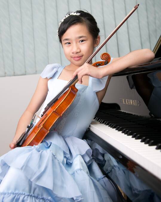 Top talent: Emma Rose Koeswandy, 8, has music at her fingertips. She is a student of MLC Burwood.