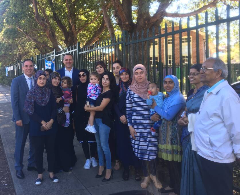 Good outcome: Shadow education minister Jihad Dib and Rockdale MP Steve Kamper with parents of Arncliffe West Infants School, are pleased the government changed its plan to re-zone the old Cairnsfoot site into a residential development.