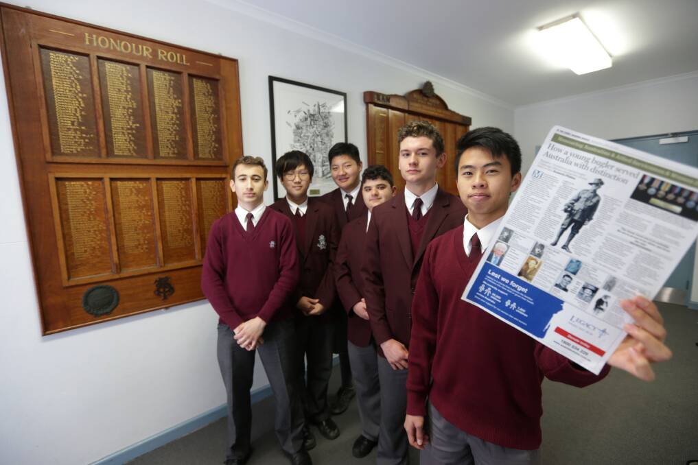 History project: Sydney Tech students Dylan, Eric, Muhammed, Han, Bilal and Leslie with their school's honour board, which is in the process of being restored. Picture: John Veage
