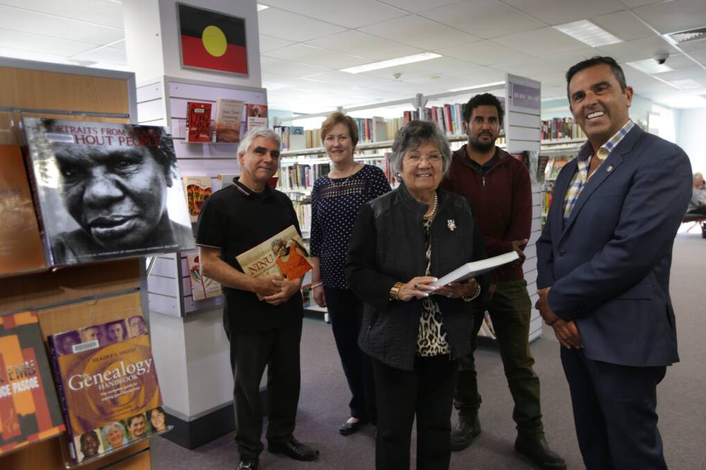 A present picture of the past: Bruce Howell, Sutherland Library manager Debbie Best, Aunty Deanna Schreiber, Yuin man Graham Avery and Sutherland mayor Carmelo Pesce at the launch of a new Aboriginal book collection. Picture: John Veage