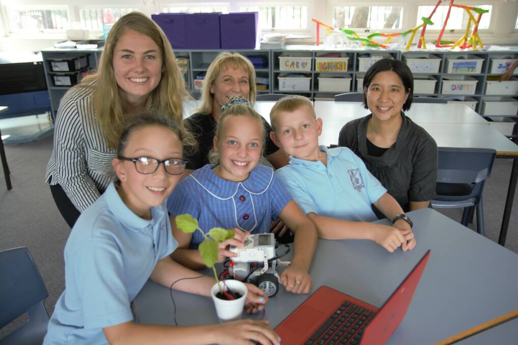Test school: Sutherland North Public School pupils including Camila, Gabrielle and Ryan will pilot a STEM program in conjunction with University of Technology, Sydney, lecturers. They are pictured with program coordinator Lauren Black and Dr Eva Cheng from UTS.