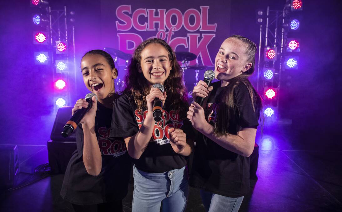 
Rockin' it out: Zoe Zantey, 11, of Sans Souci, Avaleigh Rock, 11, of Hurstville Grove and Asha Rostron, 12, of Gymea perform in School of Rock.