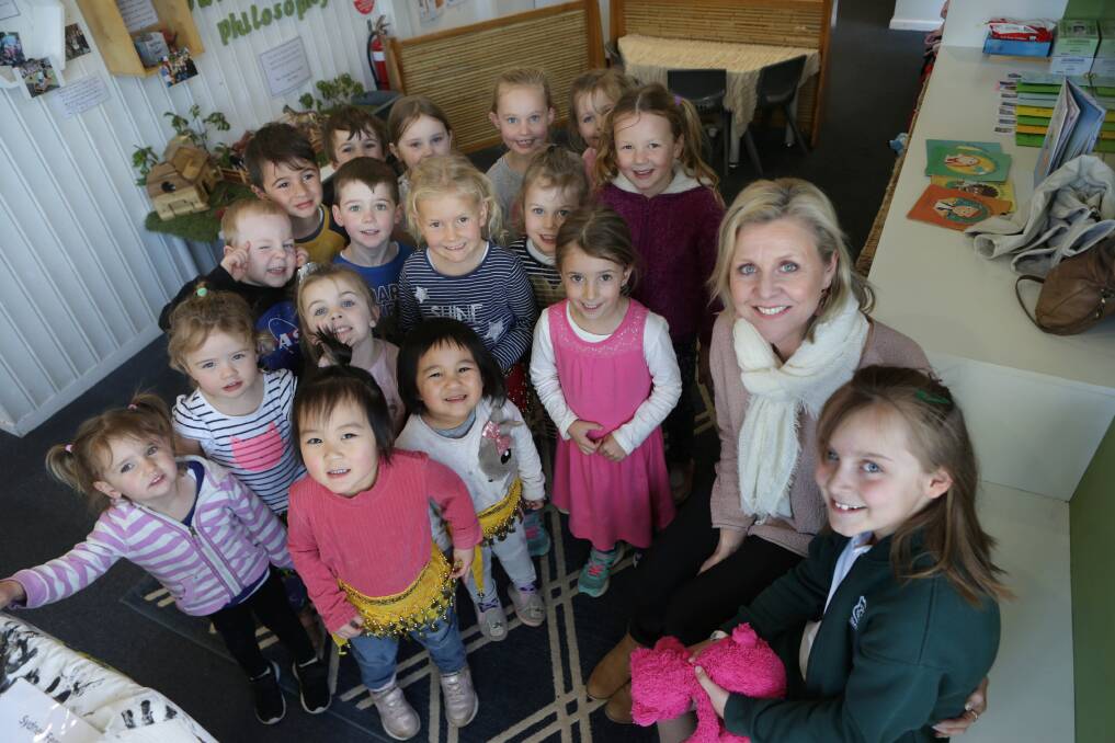 Mighty mission: Adel Stanford is hopes to launch a charity to support children with childhood cancer after her youngest daughter Mya was diagnosed with retinoblastoma as a baby. They are pictured with children from Bay Road Kindy, which is supporting the inaugural fundraiser. Picture: John Veage