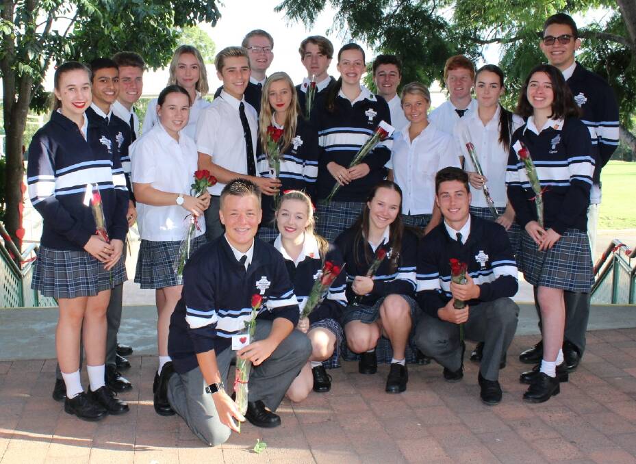 Red roses of compassion at Aquinas College