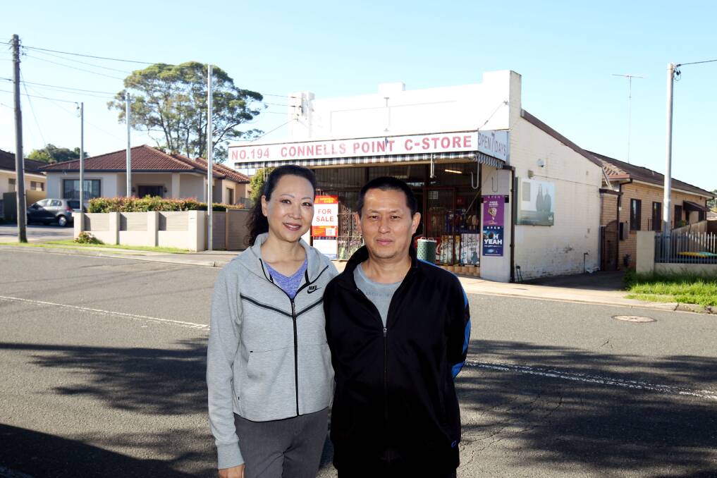 End of an era: Owners of a convenience store at Connells Point, Amelia and Allen Xu, farewell their family business after more than 18 years. Picture: Chris Lane