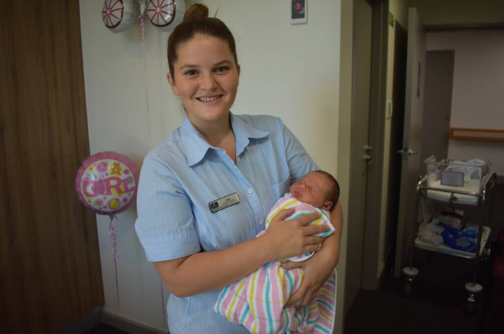 On the job: Student nurse Lara with baby Zara.