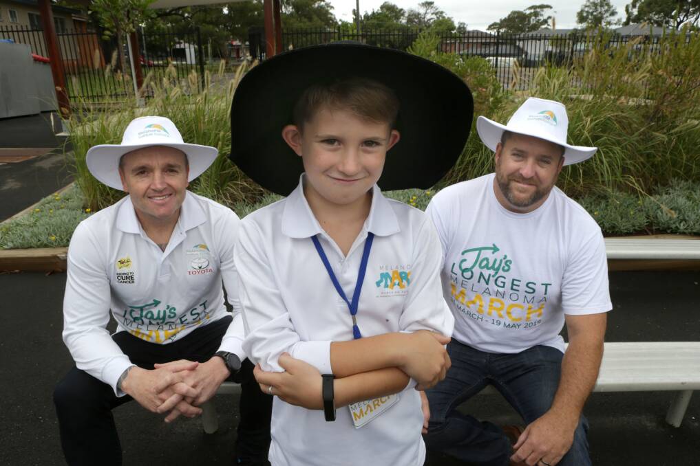 School sun safe visit: Melonoma awareness advocate Jay Allen with Lilli Pilli Public School pupil Tom Beaumont, 8, and Tom's father Dean. Picture: John Veage