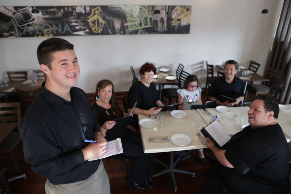 Front of house: Joshua Eagar, 21, who has Aspergers, is the latest recruit to join the Caruso's family, after the restaurant owners gladly offered him a job. Picture: John Veage