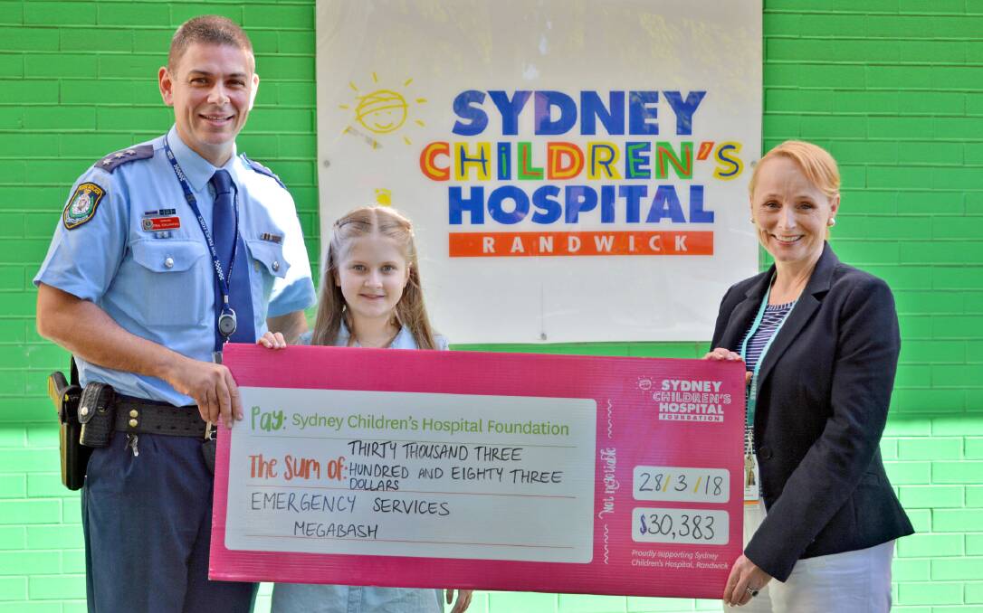 St George Police Inspector Paul Callaghan, hospital patient Lauren Channon and Sydney Children's Hospital Foundation chief executive Nicola Stokes. 