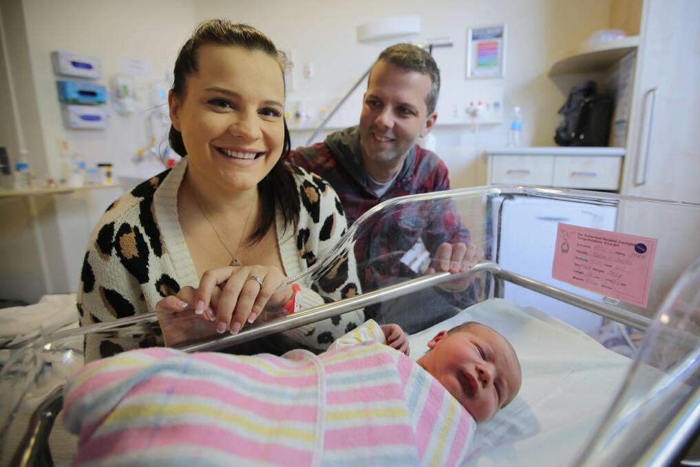 Surprise: Tania and Justin Bell with their daughter, Zara. She also made an early arrival into the world, born on Mother's Day. Picture: John Veage