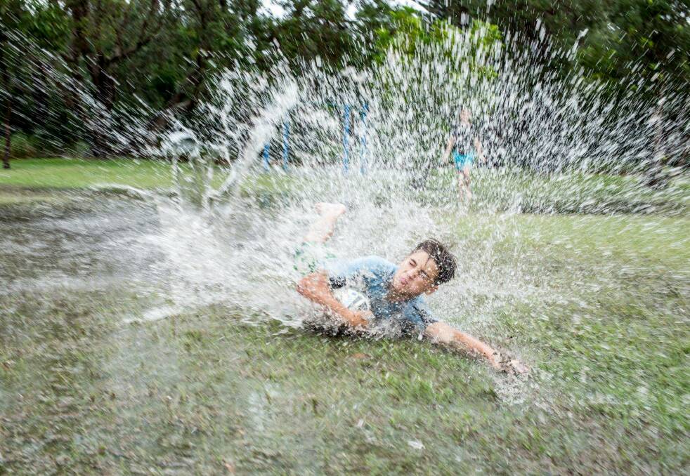 Splash: A teenager takes advantage of the wet at Kurnell. Picture: Adele Bishop on Facebook.