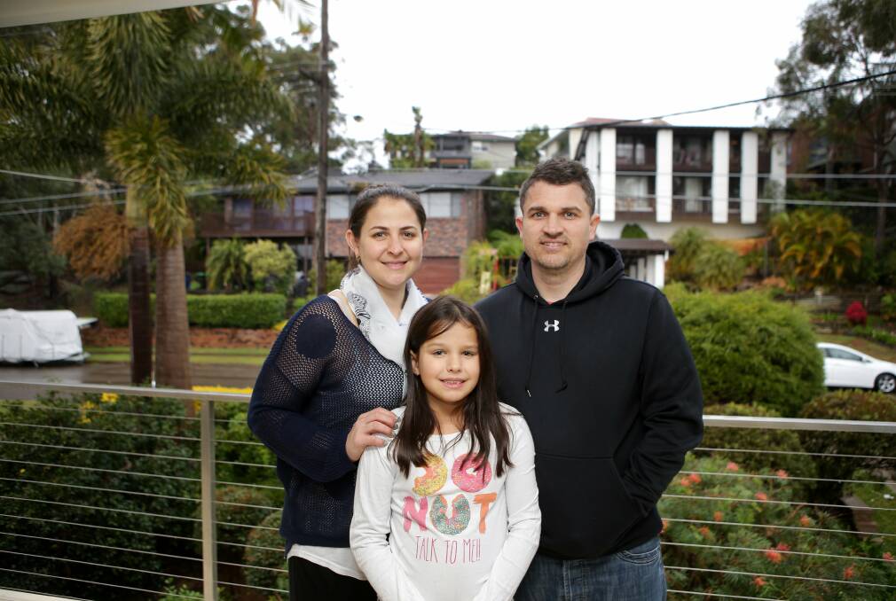 Kareela is where it's at: Briony Evans, with her partner Jamie and daughter Sienna, 9, likes the suburb's leafy surrounds. Picture: John Veage